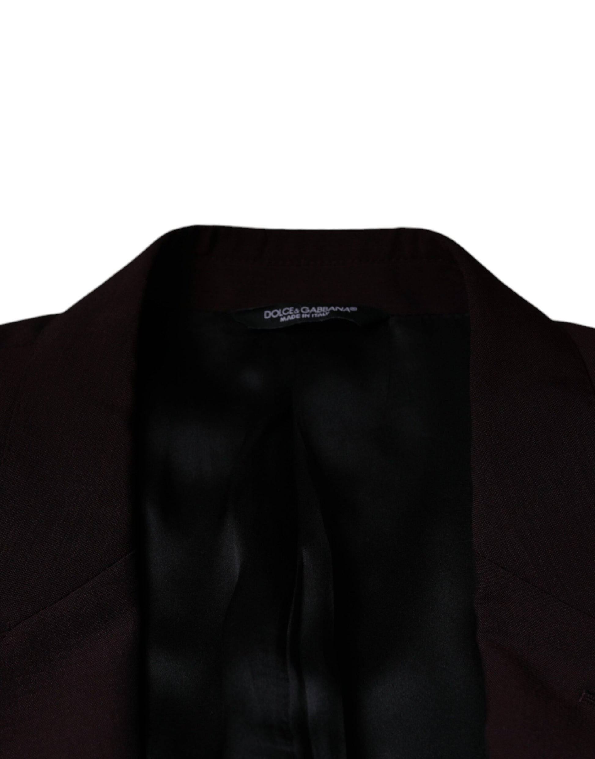 A black blazer with a single-breasted design, wool fabric, and a label that reads "Dolce & Gabbana