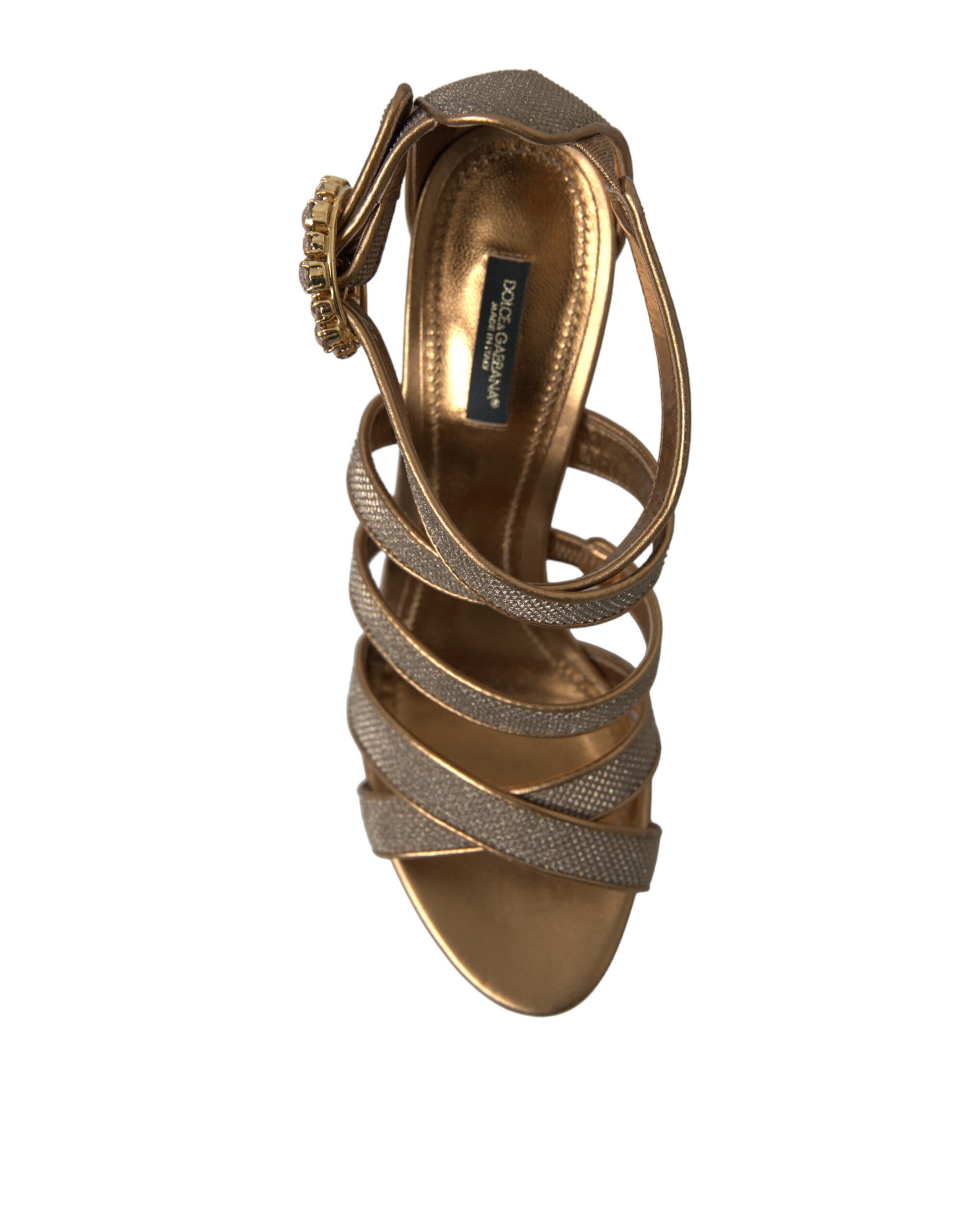 Gold strappy heel with embellishments and a bow on top