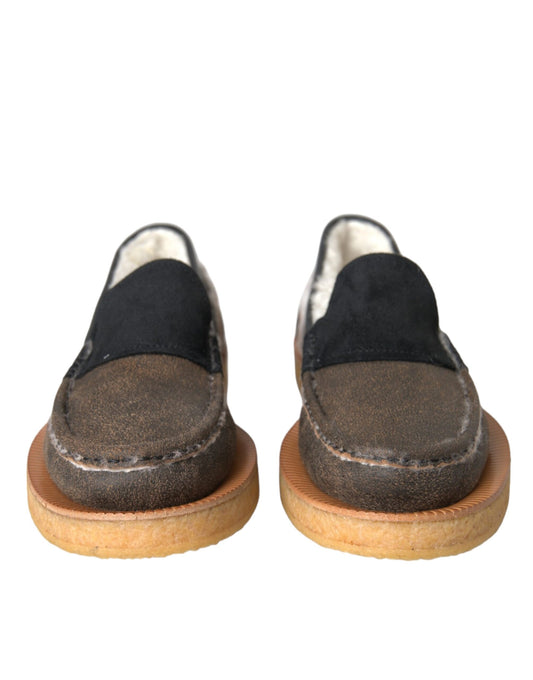 Pair of brown shoes with black soles