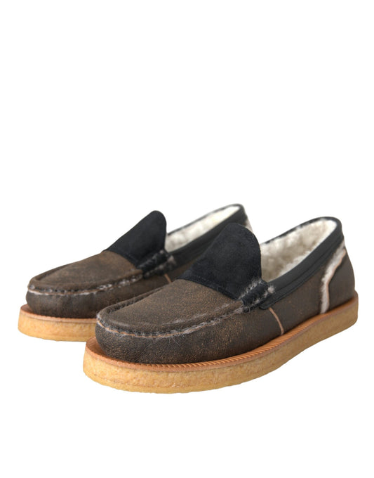 Pair of brown loafers with black trim