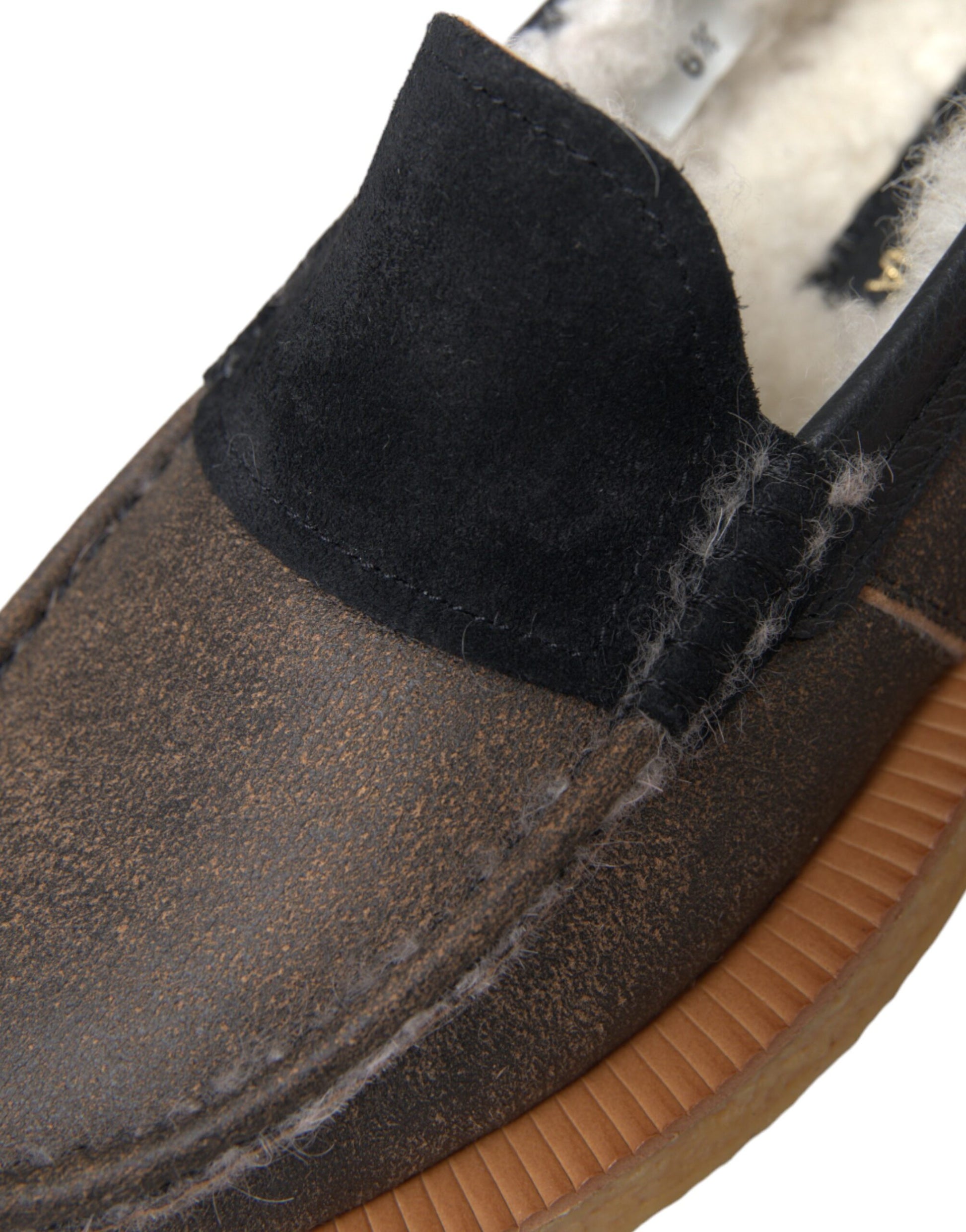 Brown shoe with black trim and tan sole