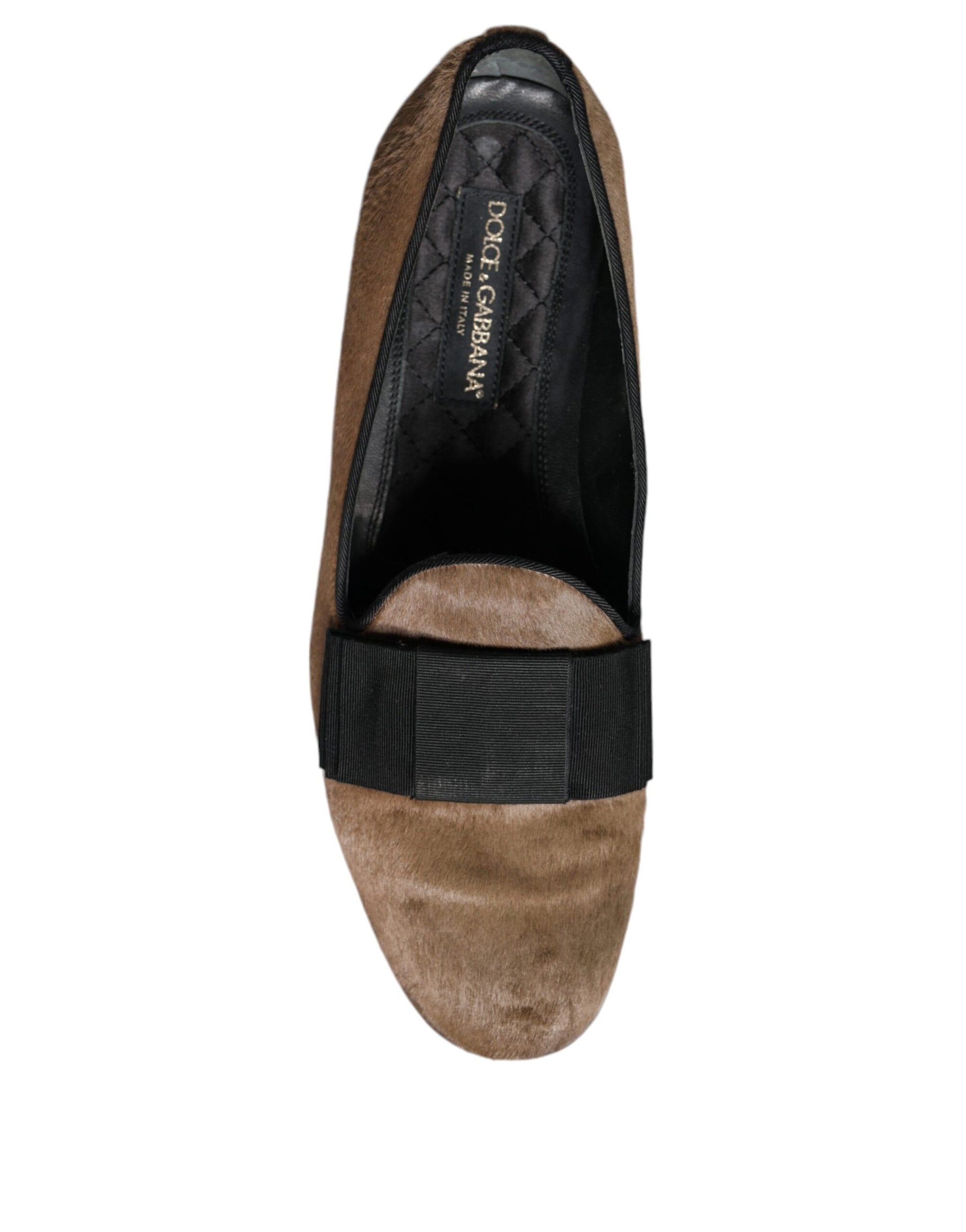Brown leather loafers with black strap and logo on side