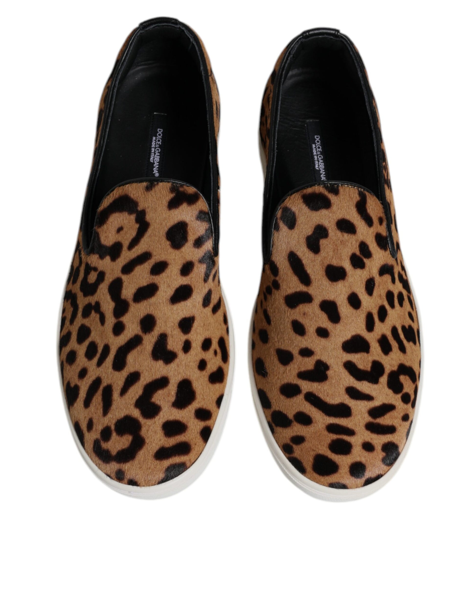 Pair of brown shoes with black soles and leopard print pattern on top