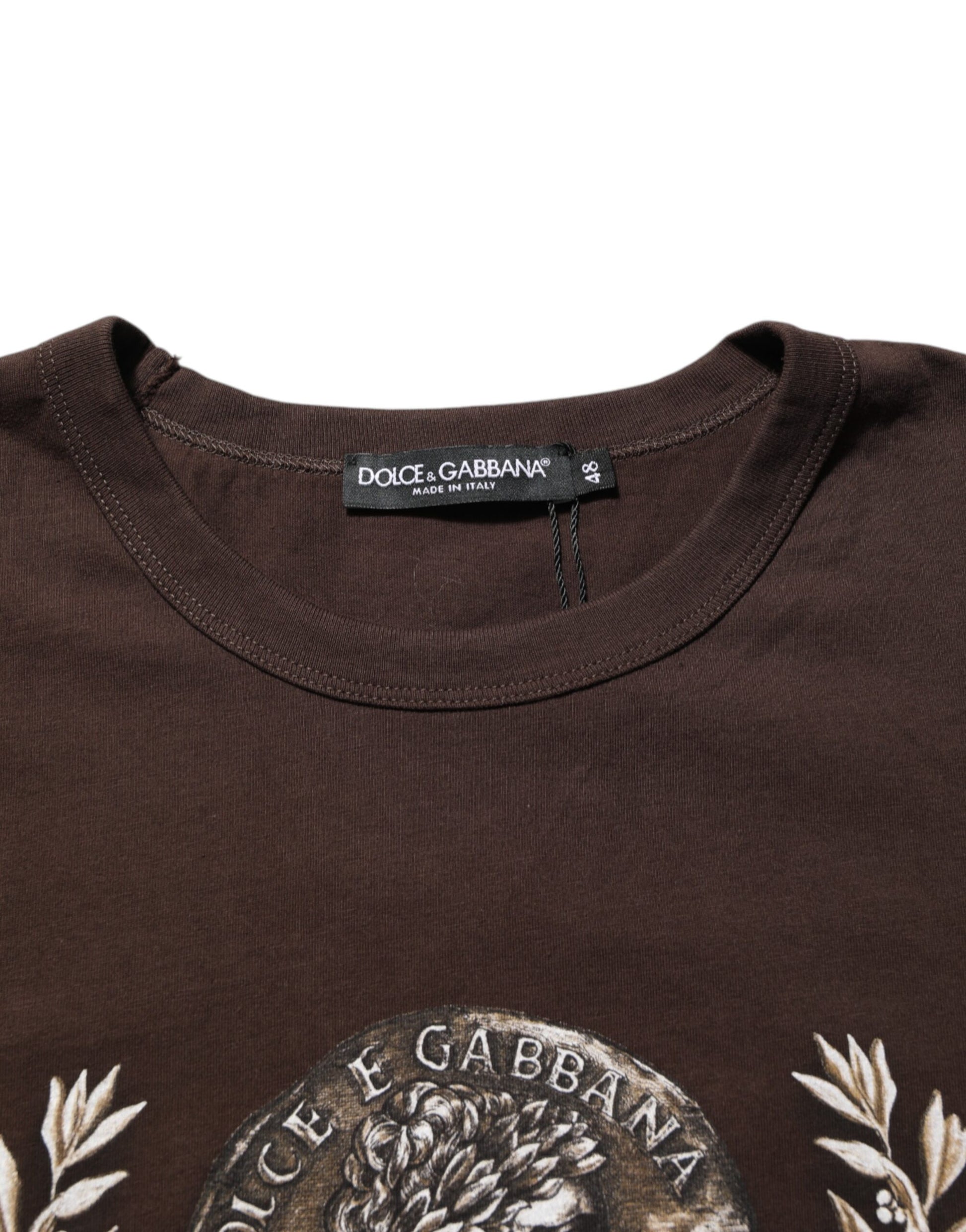 Brown sweater with embroidered emblem on front