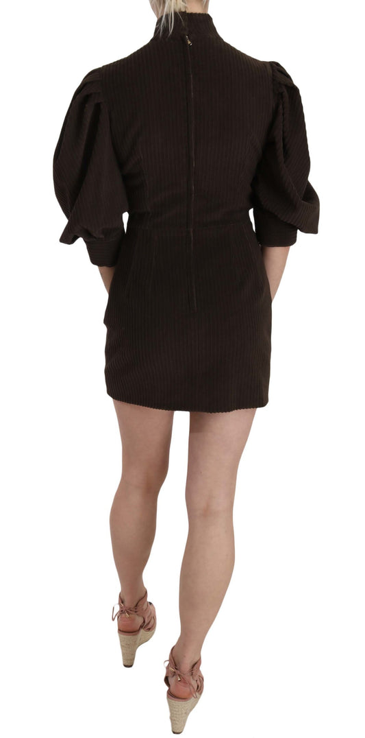 A black bodycon dress with short sleeves and a high neckline