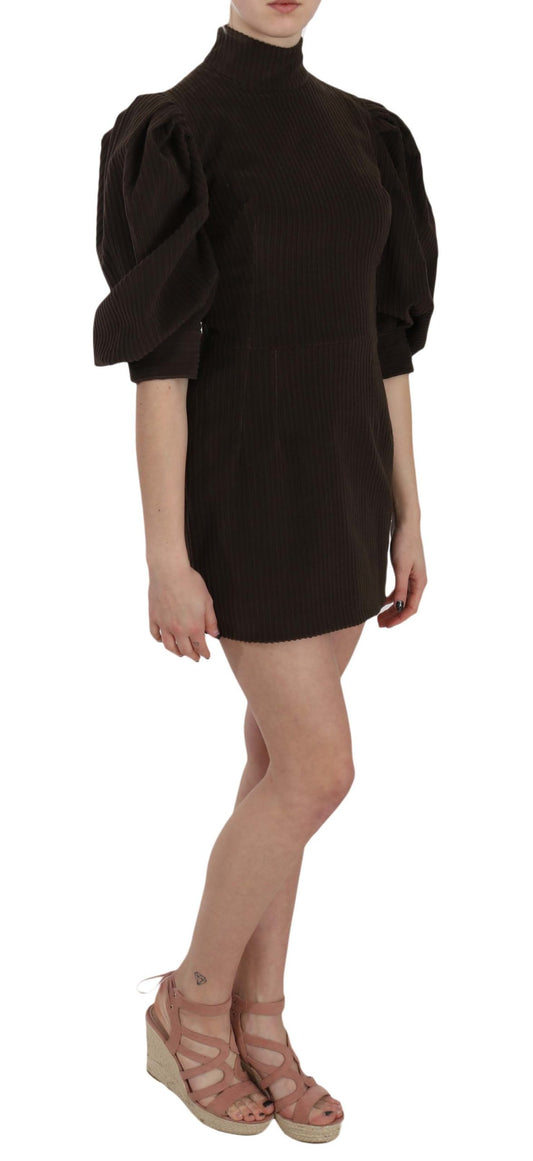 A woman wearing a brown corduroy bodycon dress with short sleeves and ruffled shoulders