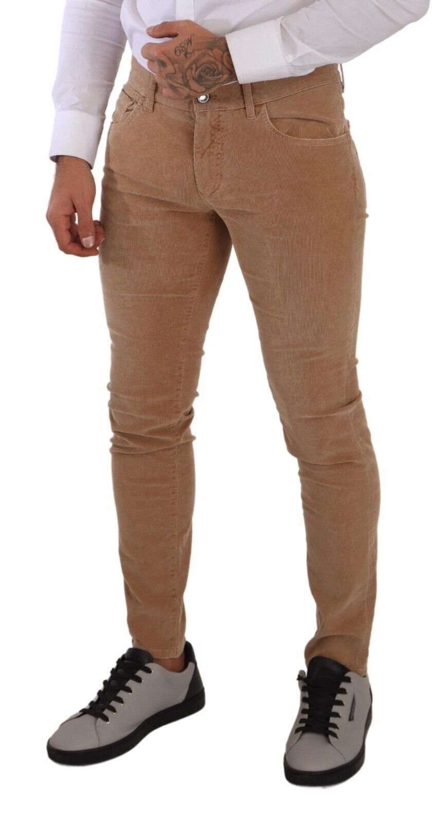 Man wearing brown pants and black shoes