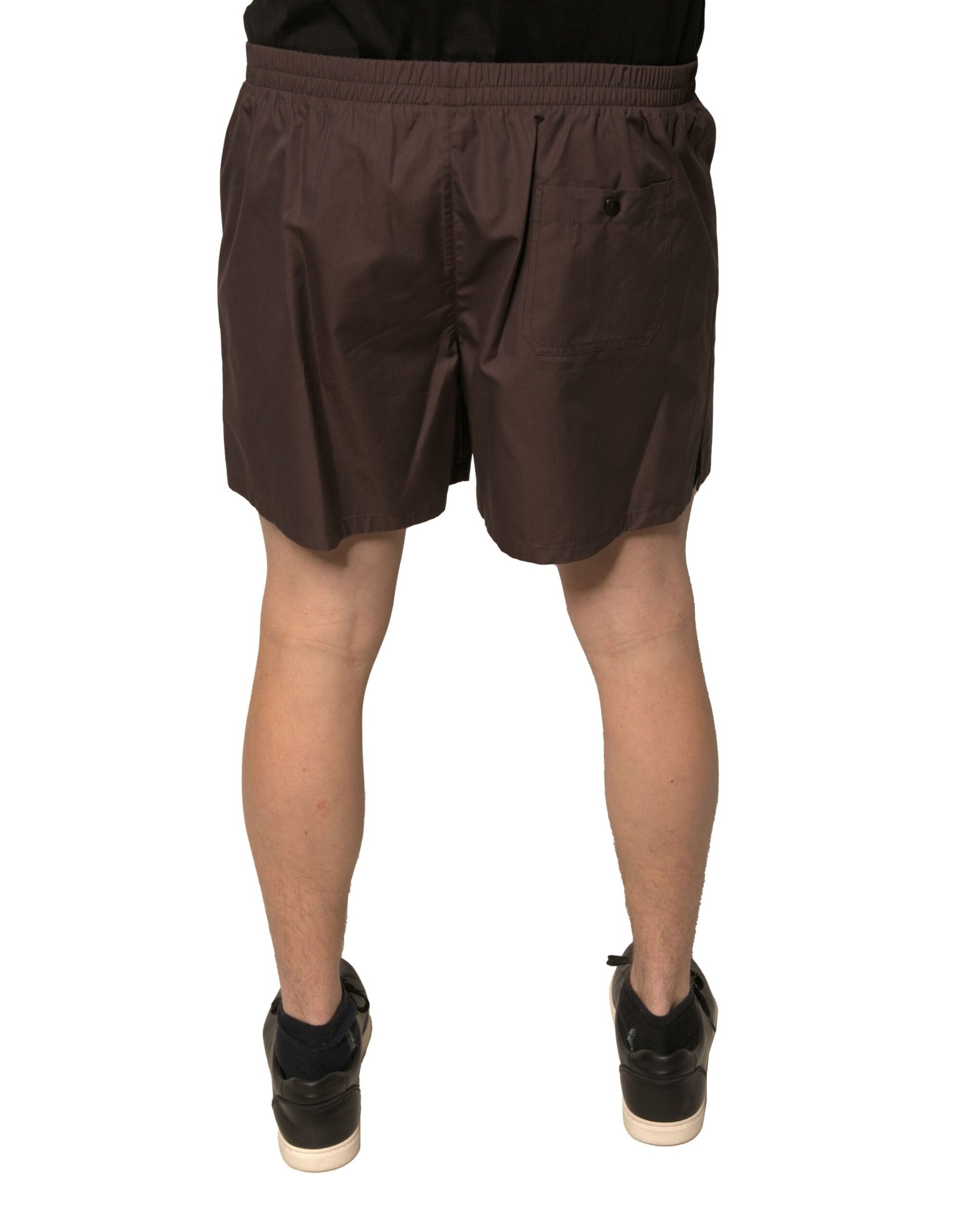 A pair of brown cotton blend men's shorts with a mid-waist design