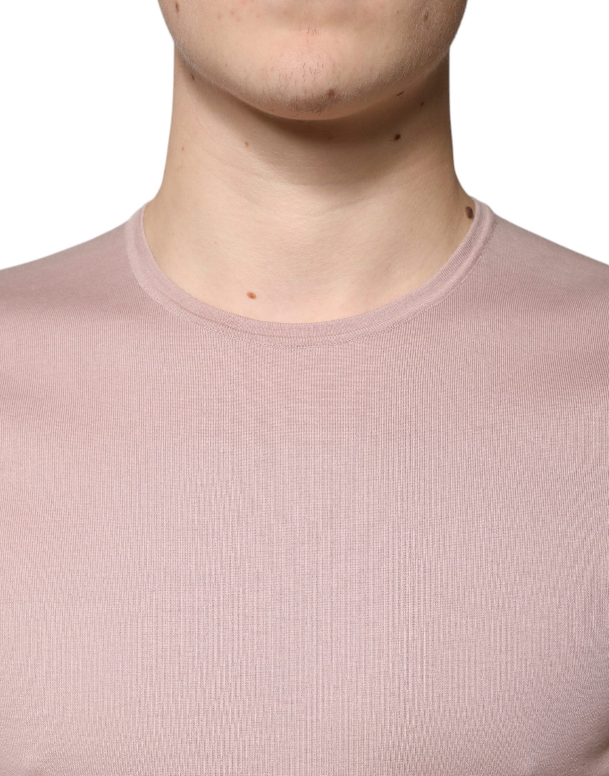 Man wearing a pink sweater