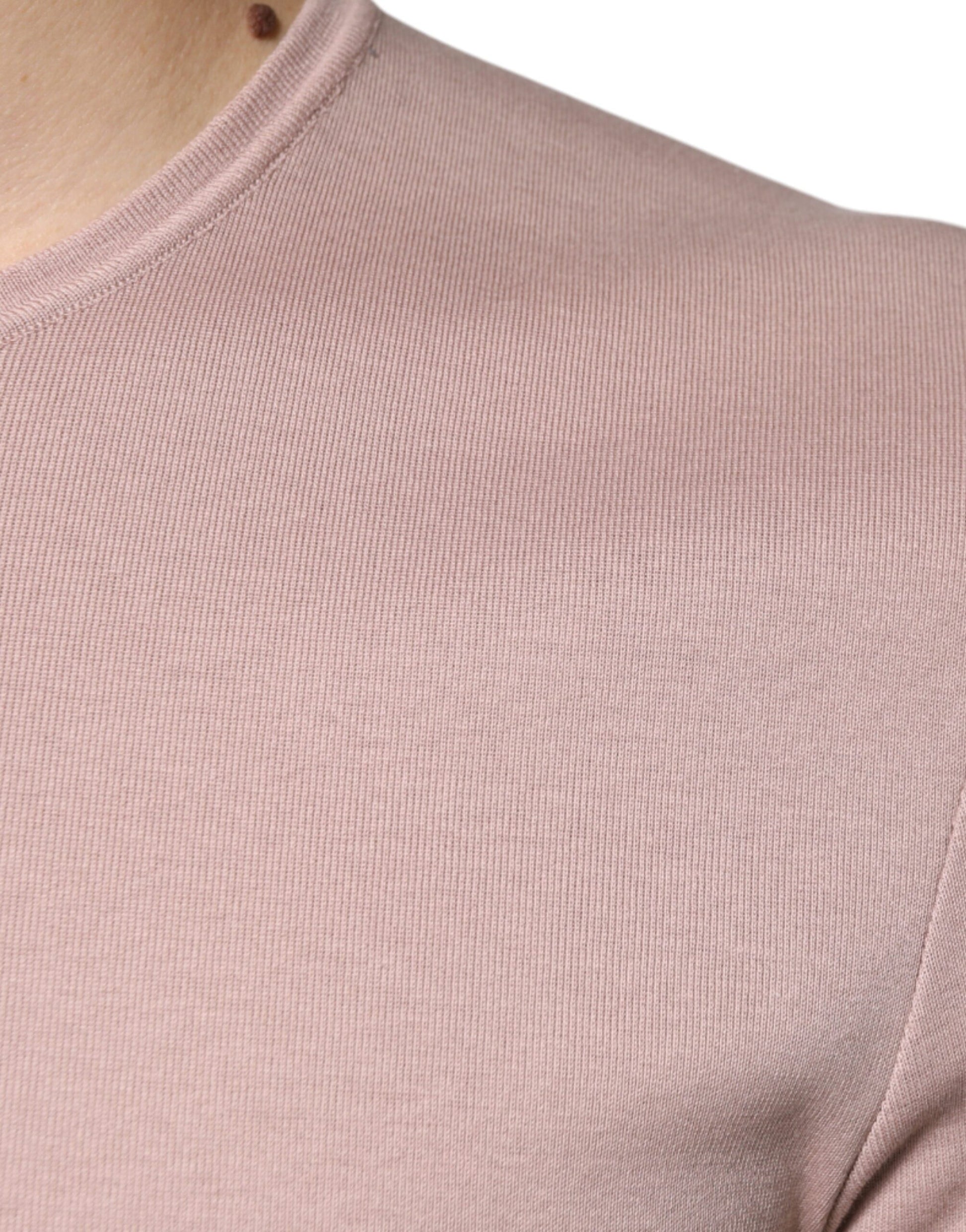 Pink long sleeve shirt on a mannequin torso