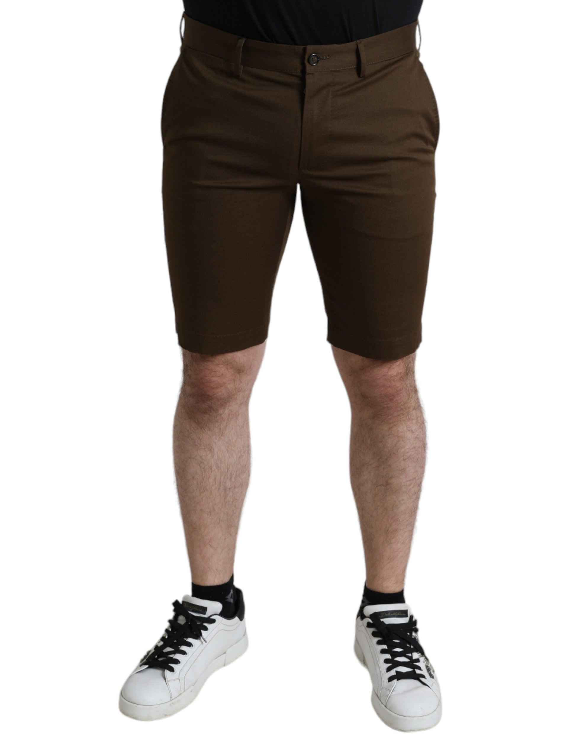 Man wearing brown shorts and black shoes