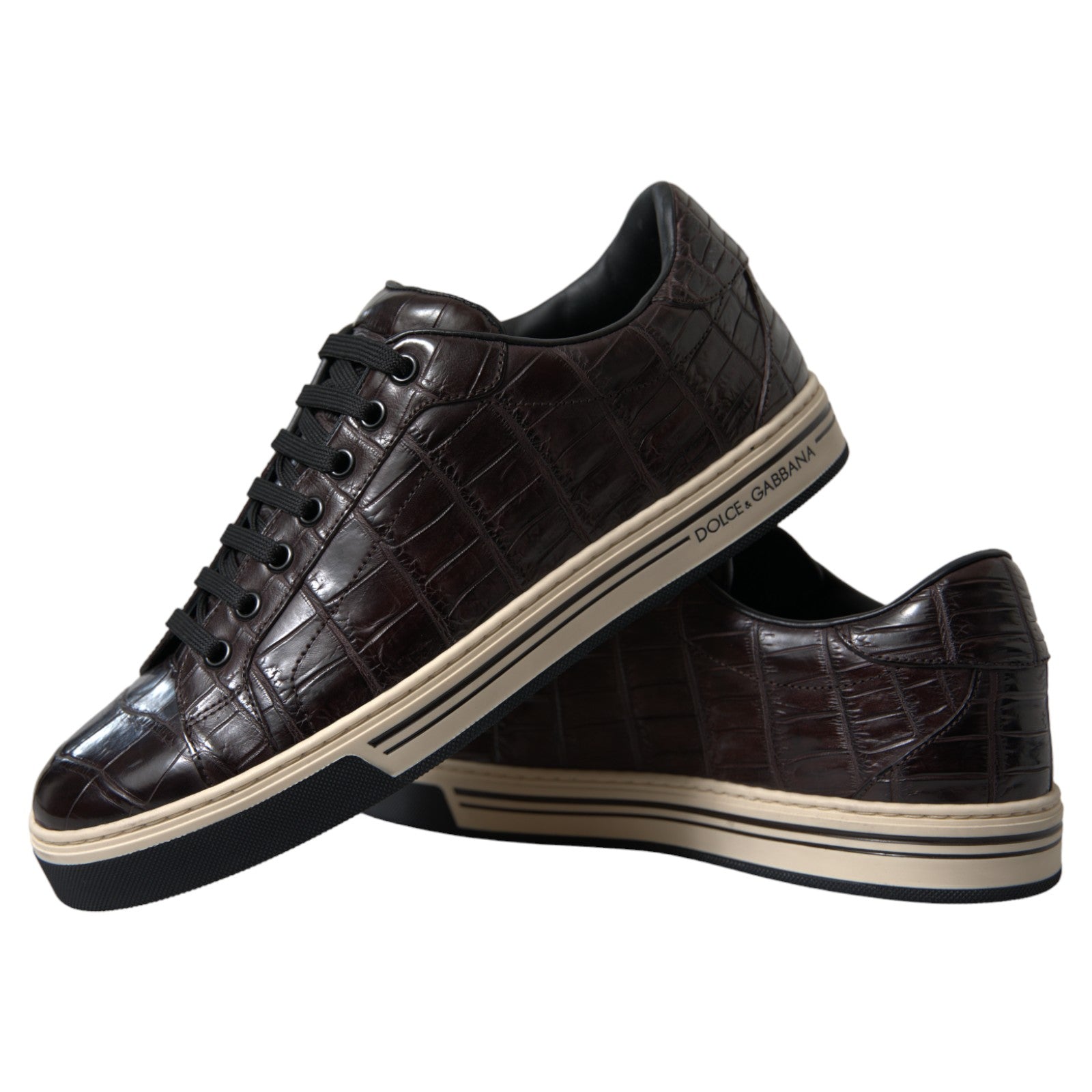Pair of brown crocodile skin sneakers with white soles, laces and trim