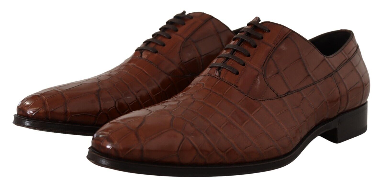 Pair of brown leather shoes with laces and a small heel