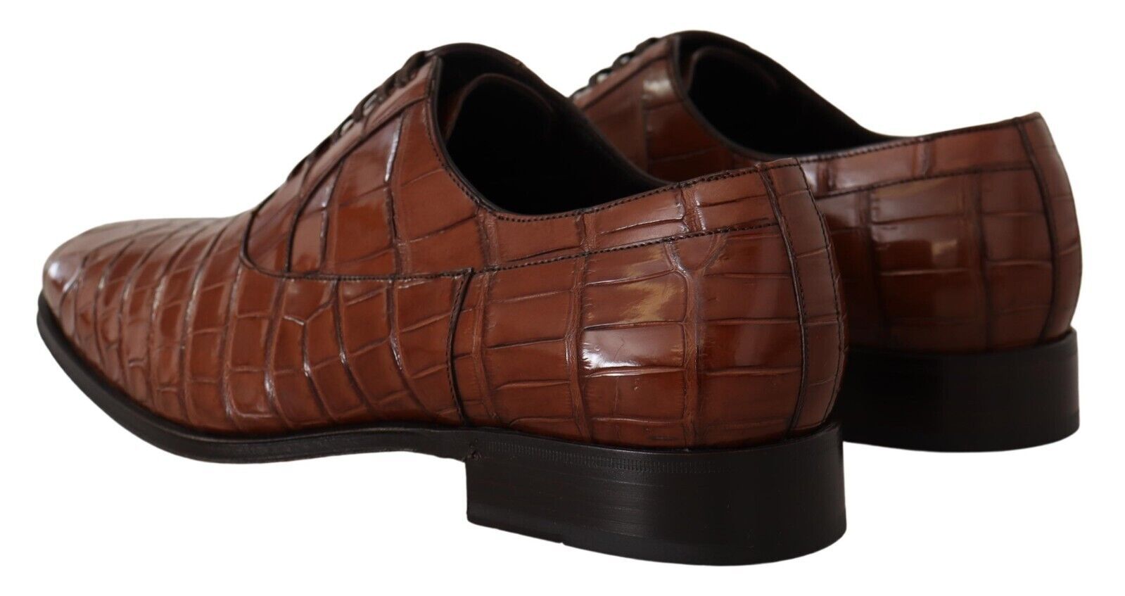 Pair of brown leather shoes with a shiny finish