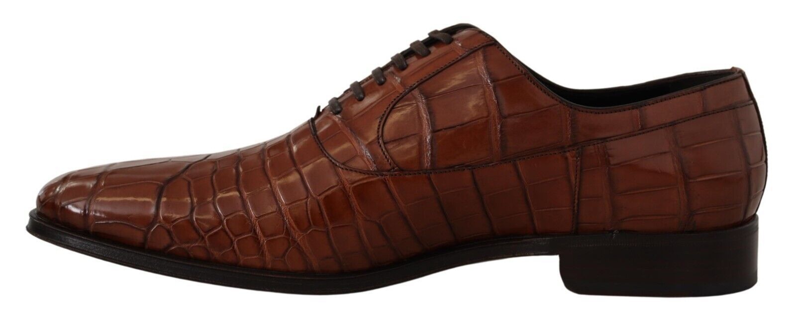 Brown leather shoes with laces and a strap across the top