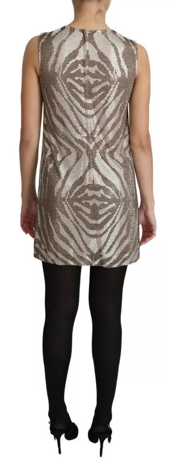 A sleeveless dress with a zebra print and crystals on the bodice