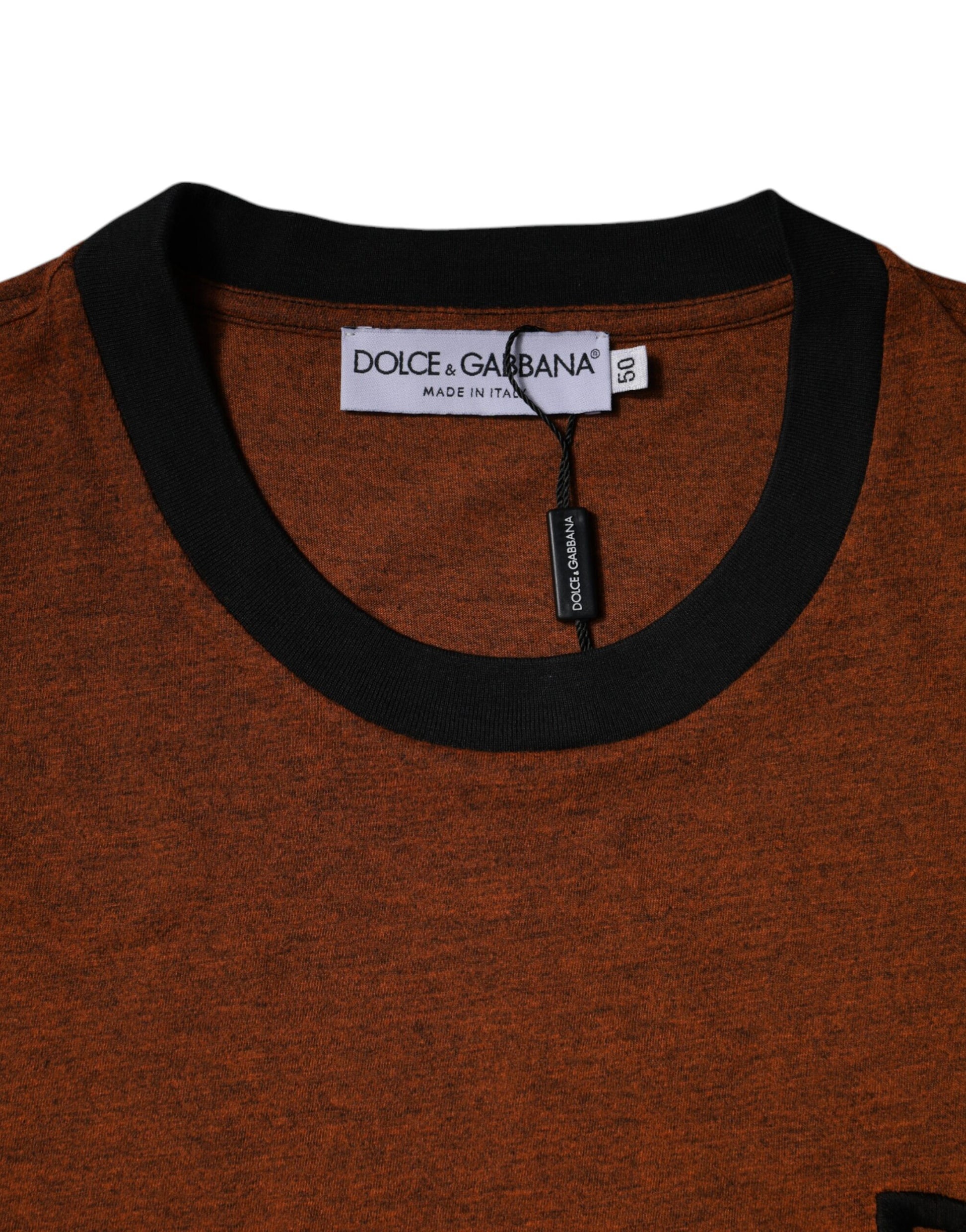 Red sweater with black collar and zipper tag