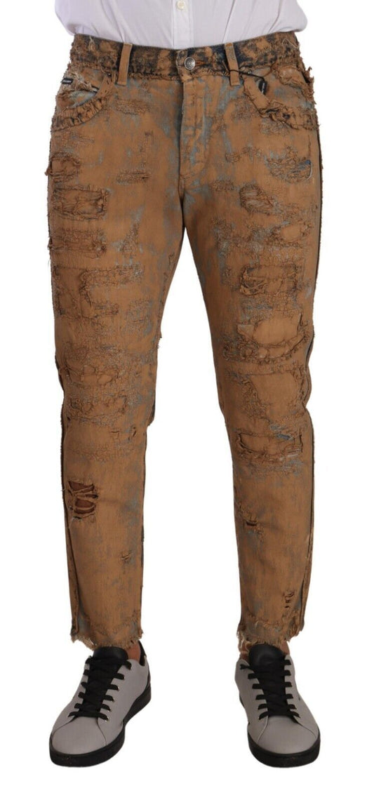 Brown distressed jeans with faded patches on legs