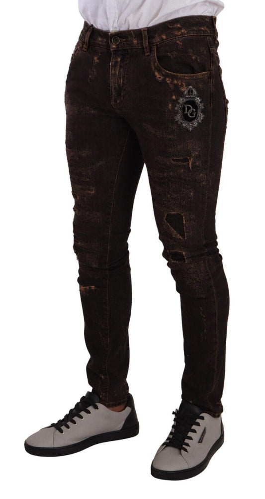 Pair of distressed jeans with a logo on the right leg