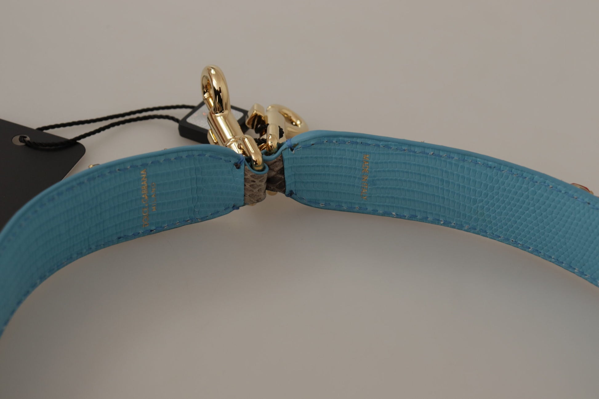 Blue belt with gold buckle