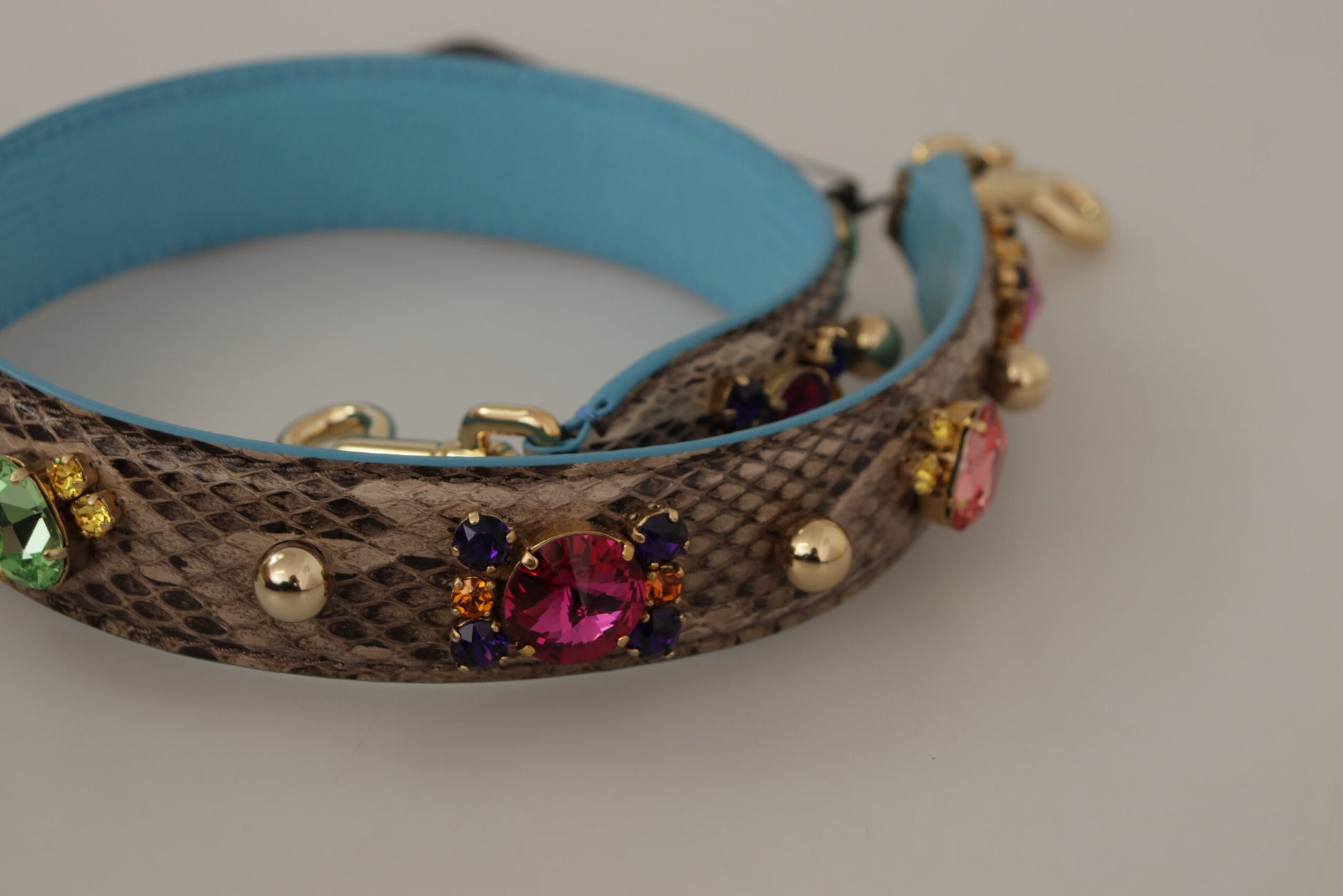 Blue and brown bracelet with colorful beads and gold accents