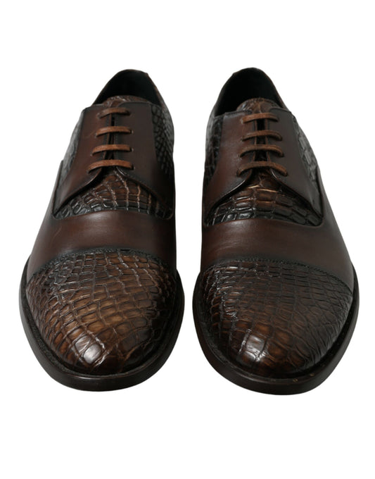 Pair of brown leather shoes with laces and a crocodile skin pattern on the vamp
