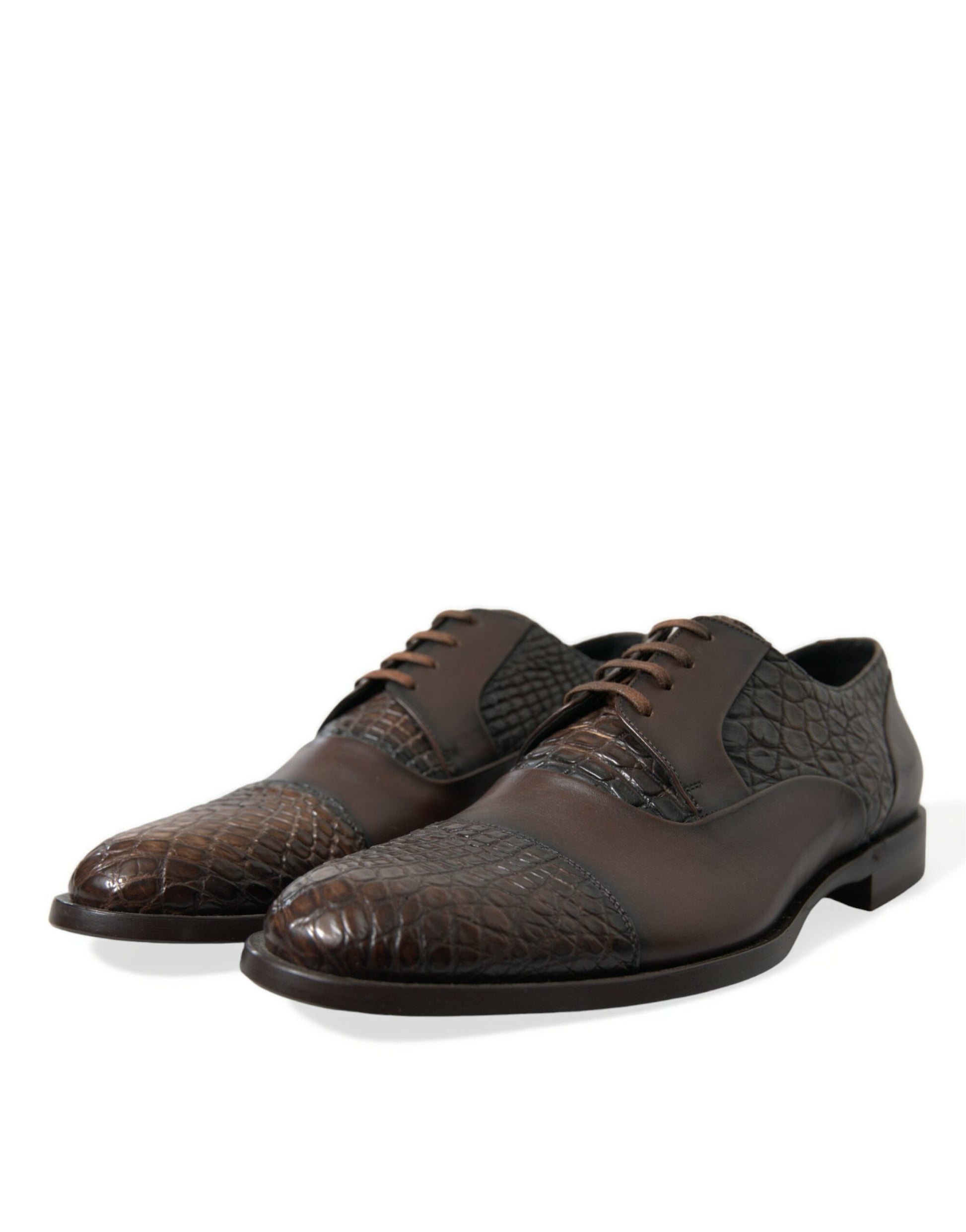 Brown leather shoes with laces and a patterned design on the vamp