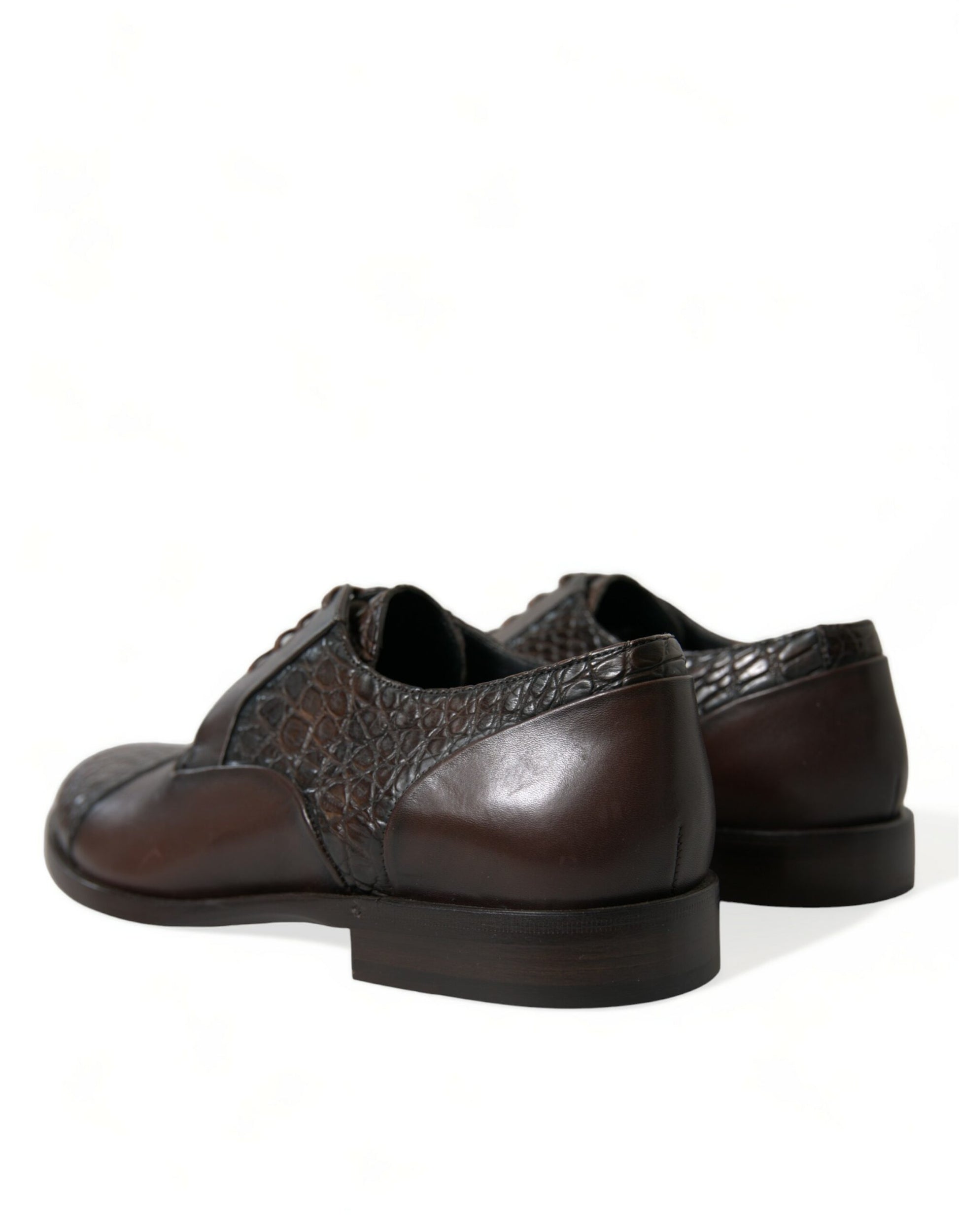 Pair of brown leather shoes with laces and a patterned design on the vamp