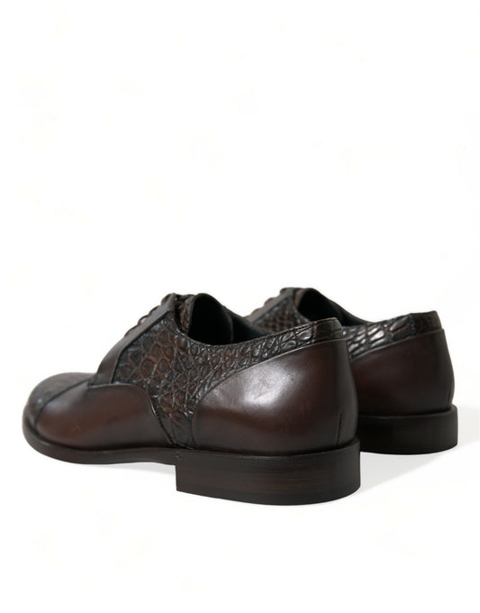 Pair of brown leather shoes with laces and a patterned design on the vamp