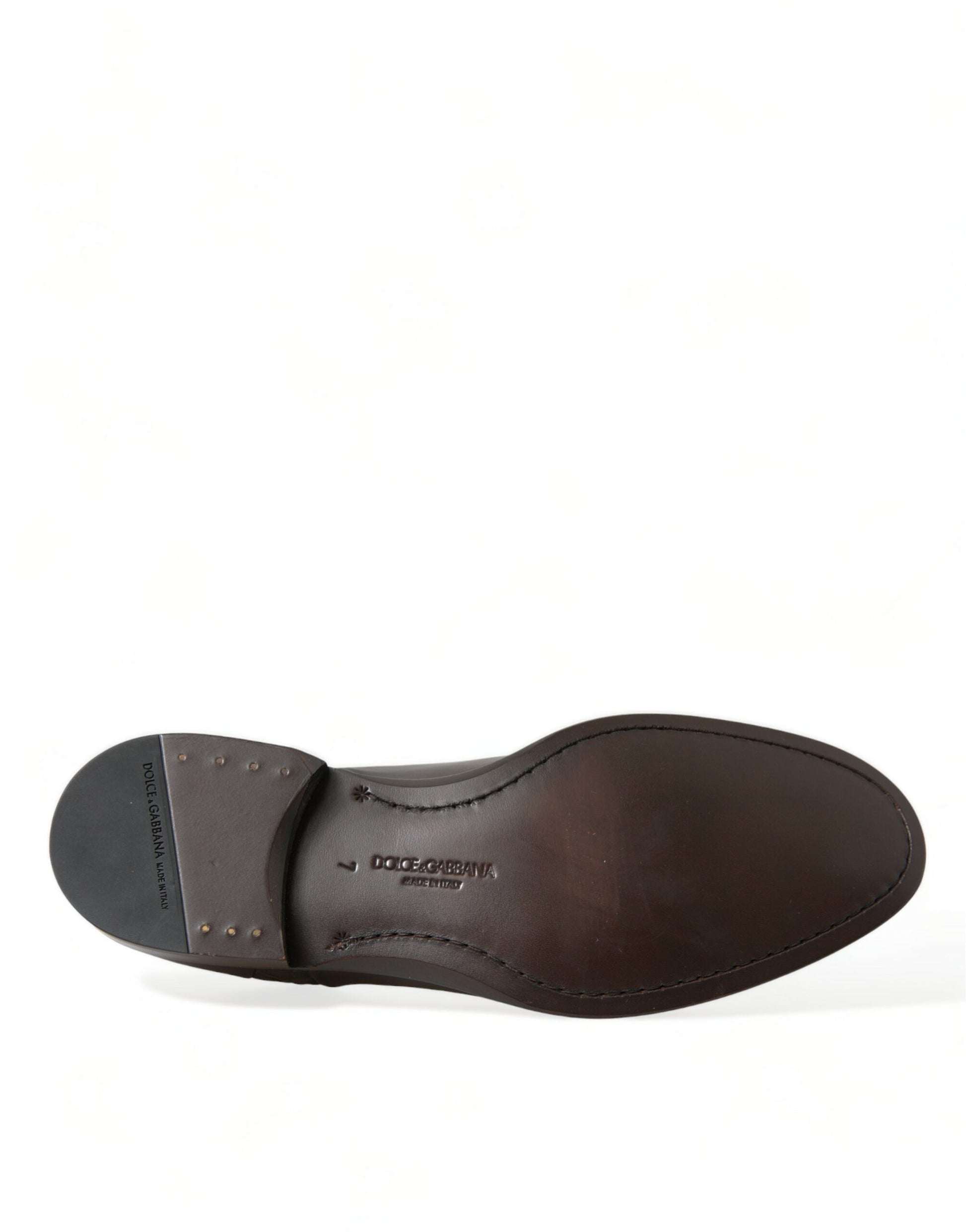 Brown leather shoe with laces and a heel