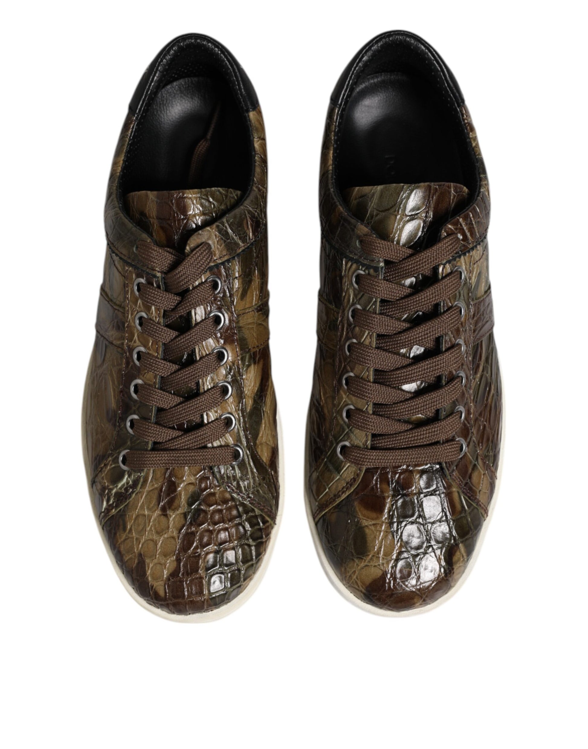 Pair of camouflage sneakers with brown laces