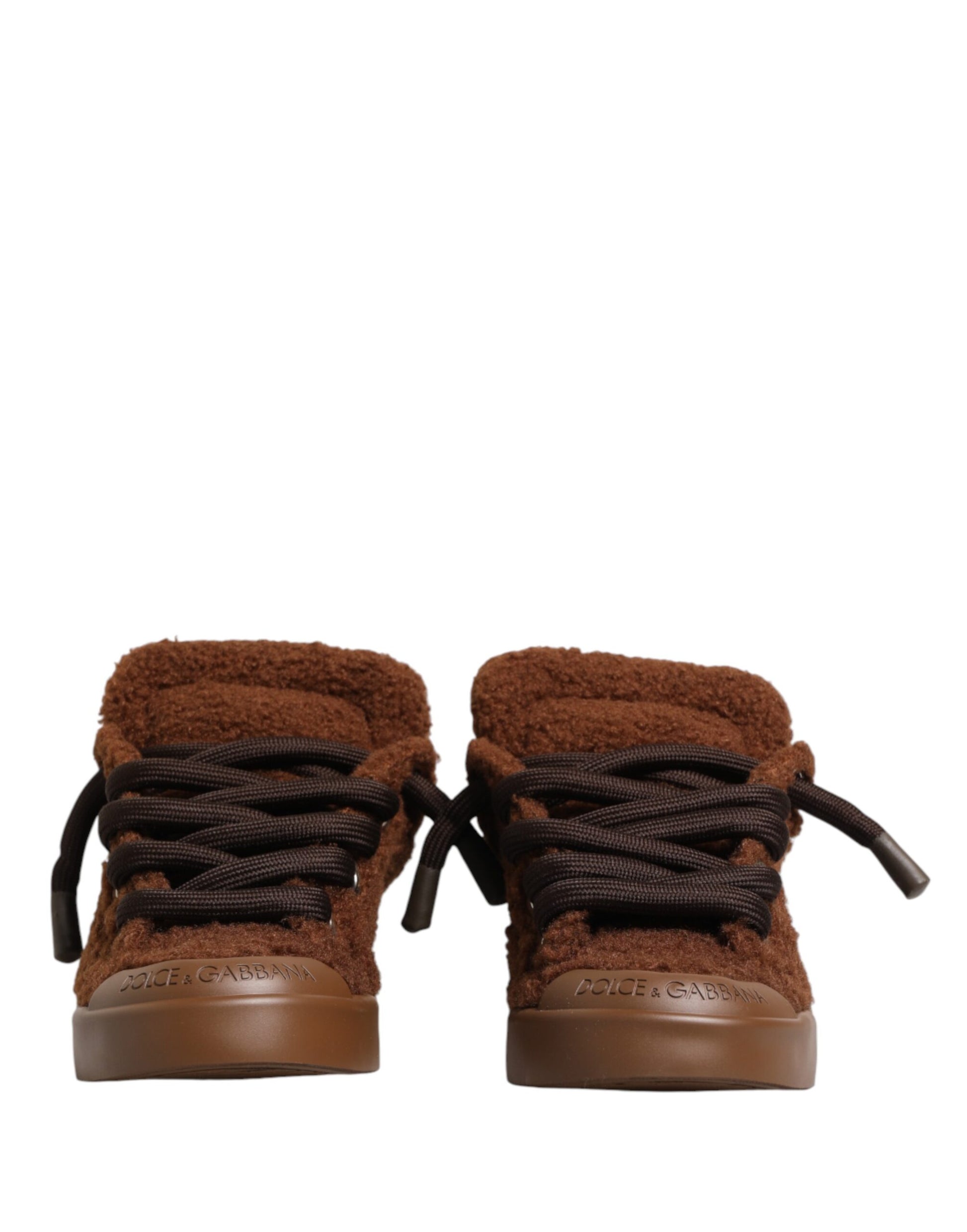 Pair of brown faux shearling sneakers with laces and a low top
