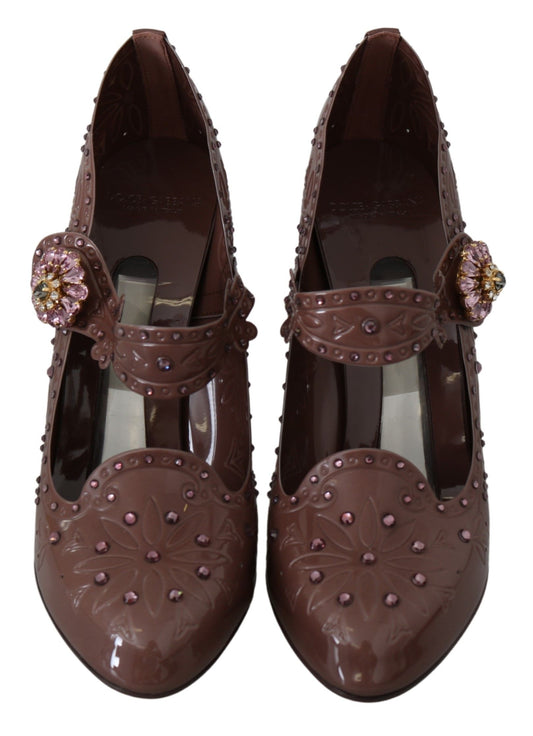 Pair of brown shoes with embellishments and heels