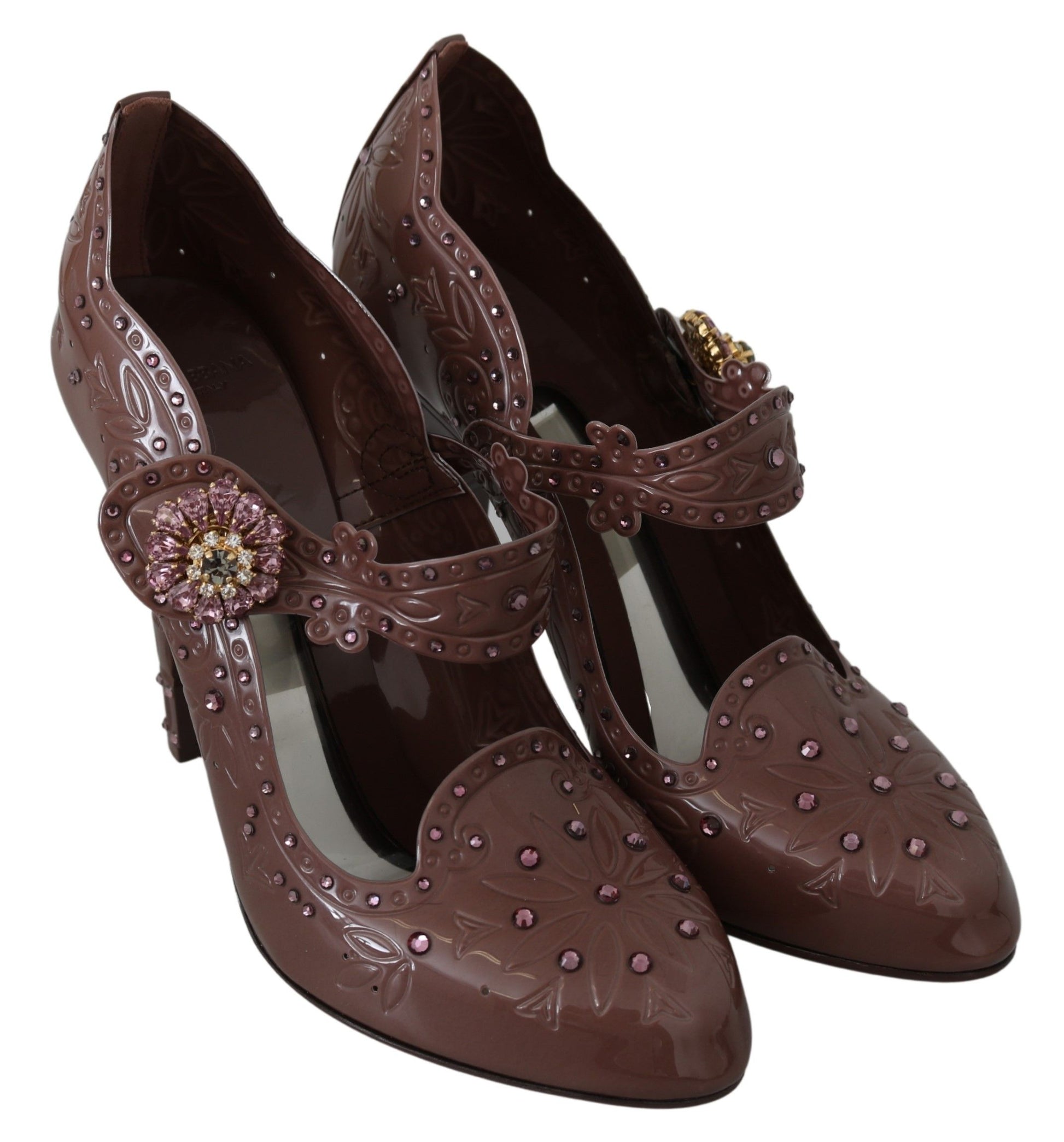 Pair of brown high heel shoes with pink and gold accents