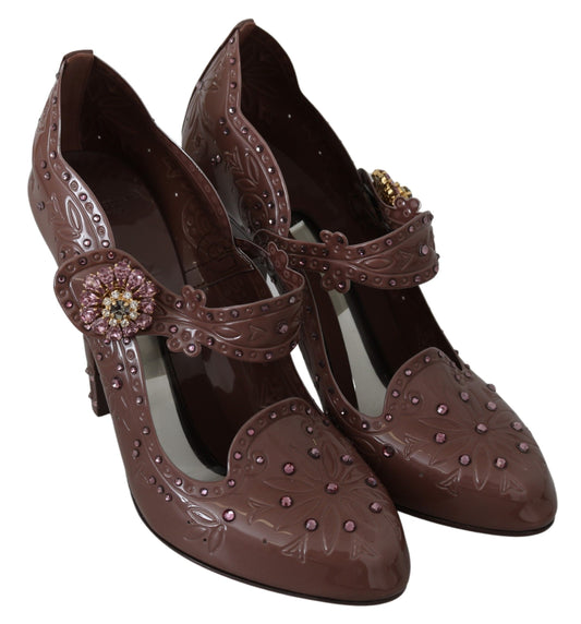 Pair of brown high heel shoes with pink and gold accents