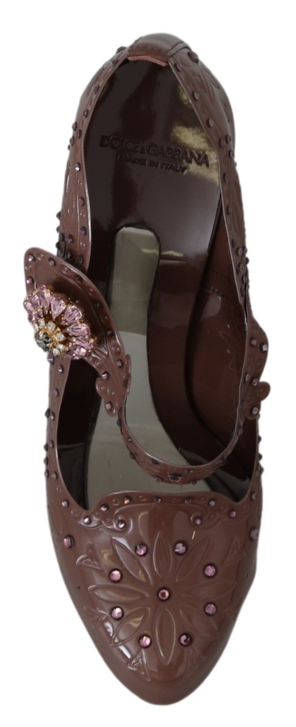 Brown shoe with embellishments and a bow on top