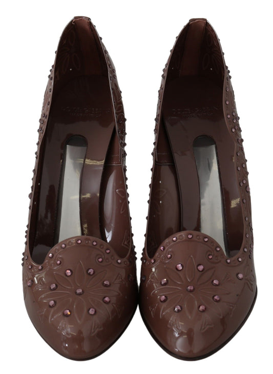 Pair of brown shoes with embellishments and heels