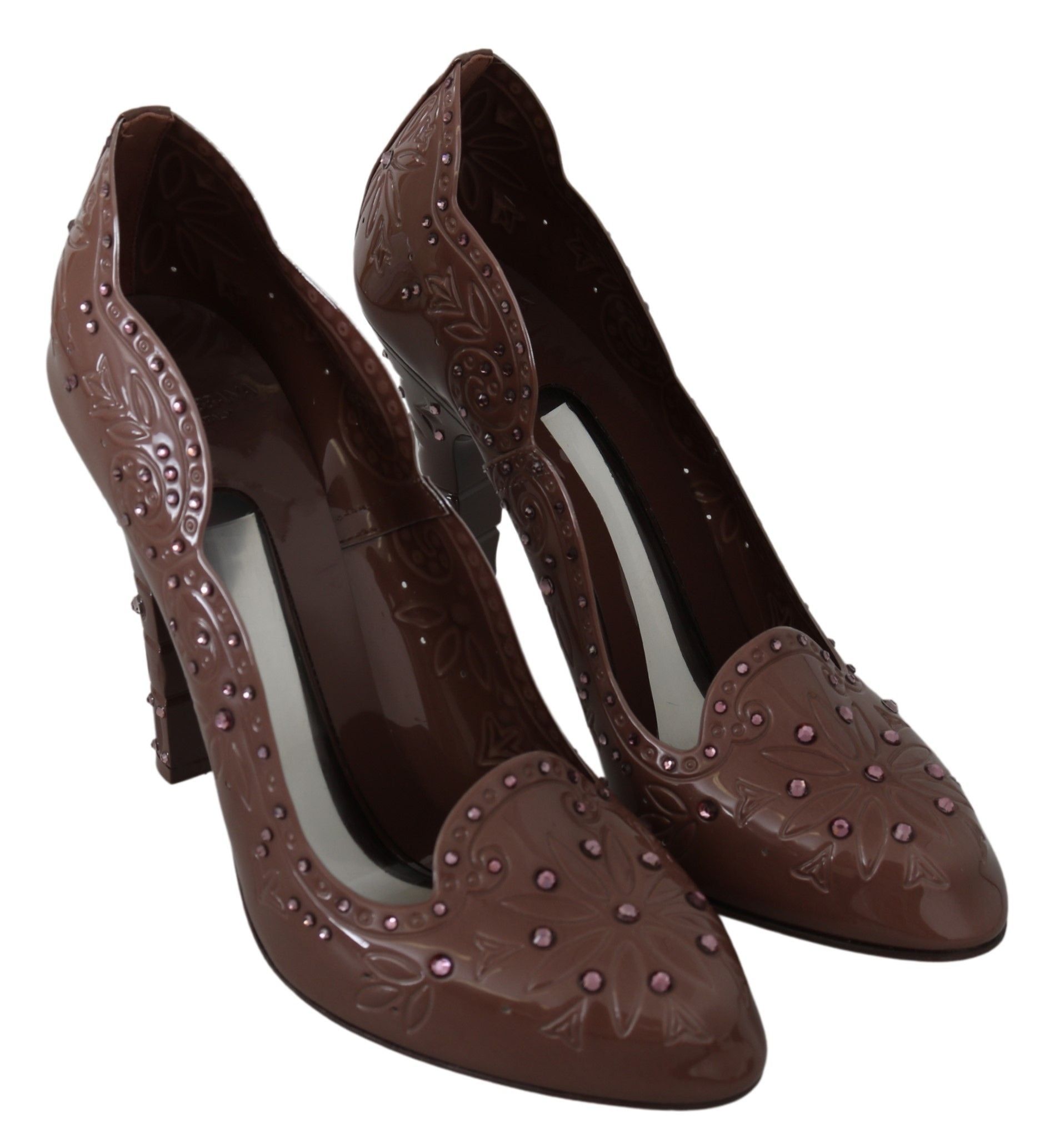 Pair of brown high heel shoes with embellishments and a pointed toe design