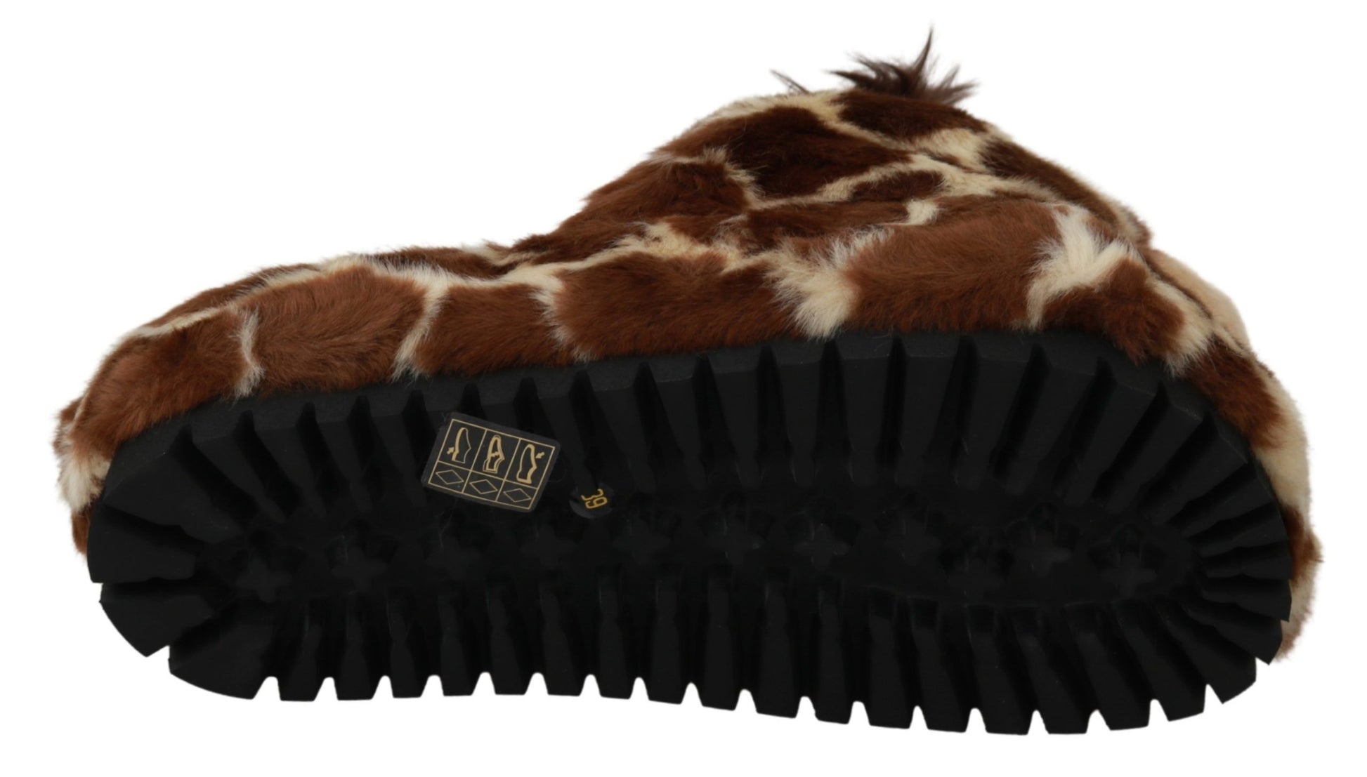 Brown and white furry slippers with black soles