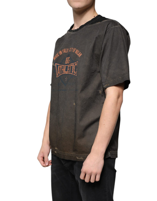 Man wearing a brown t-shirt with graphic design on front