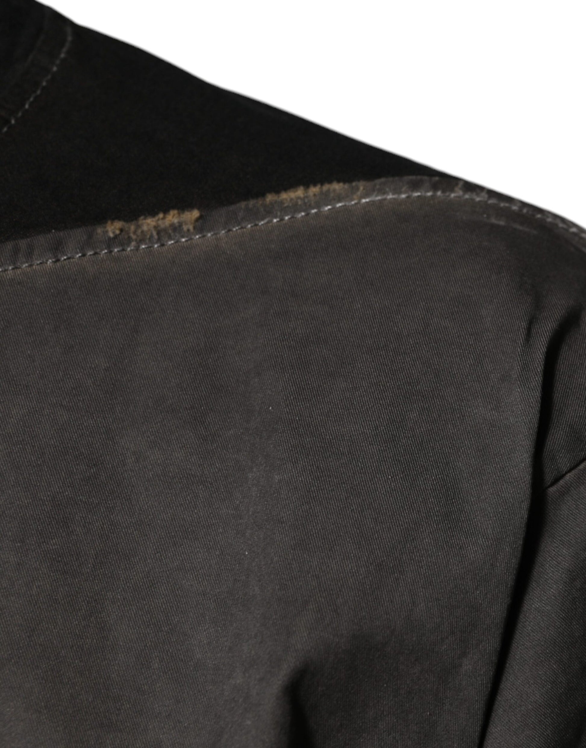 Dark denim jacket with visible stitching on sleeve