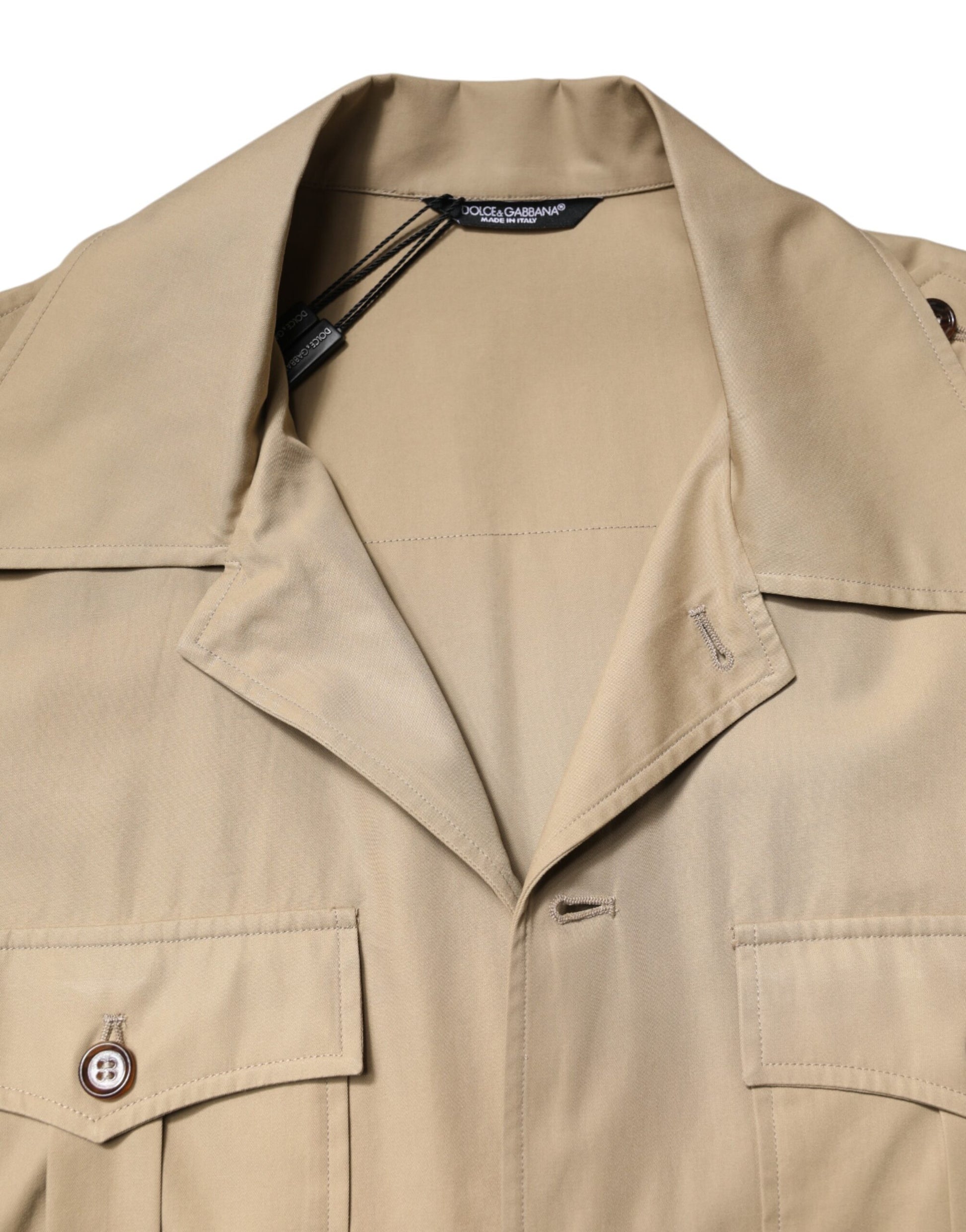 Tan trench coat on hanger