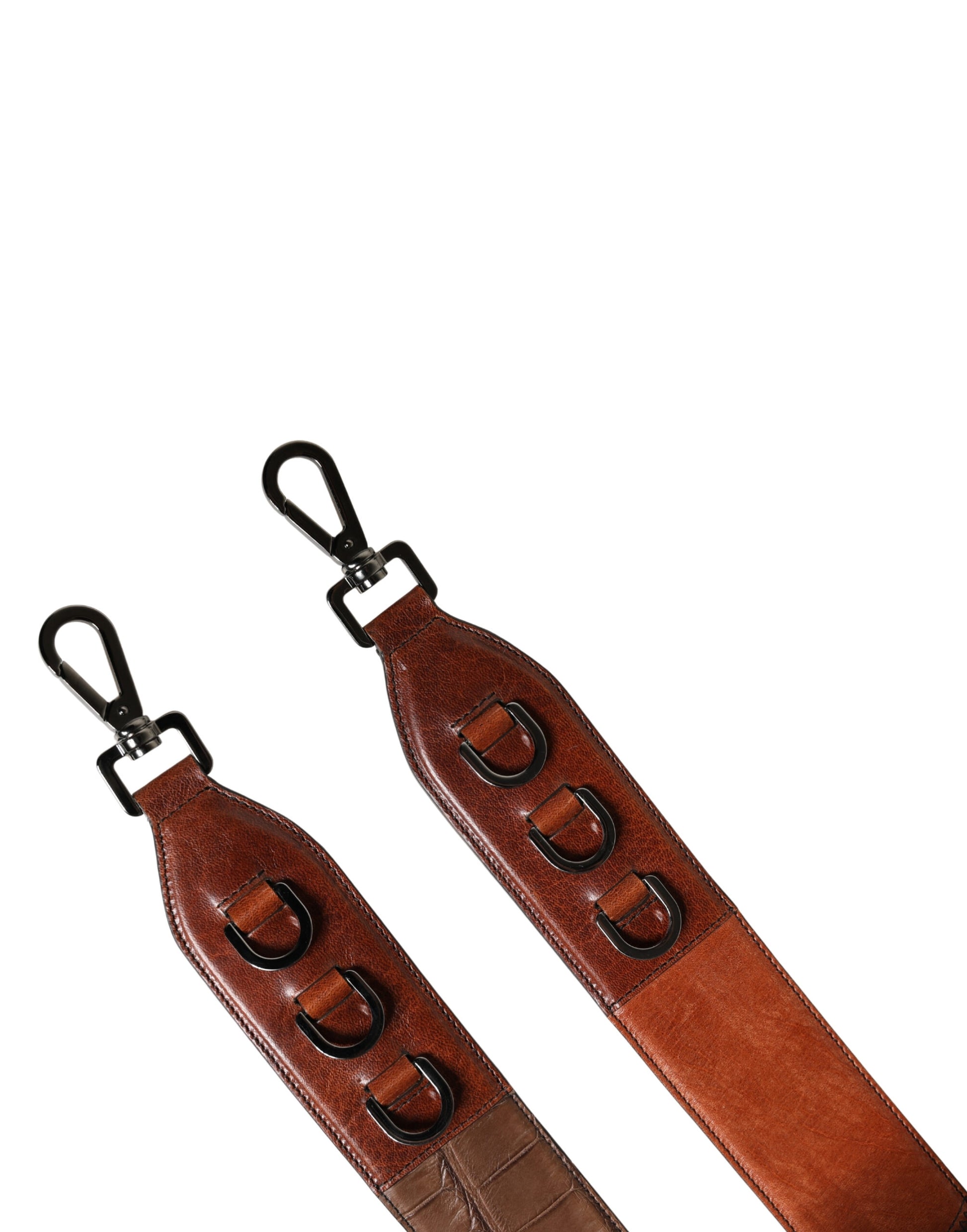 Two brown leather belts with metal buckles