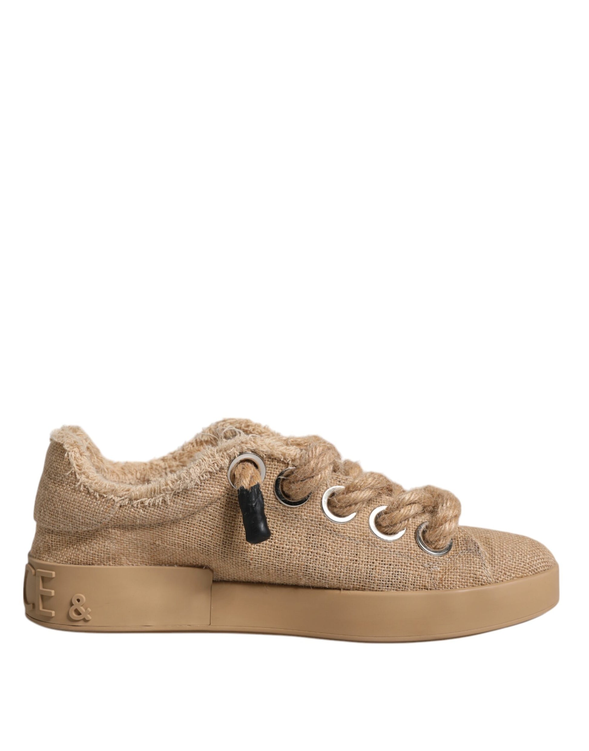 Tan baby shoe with laces and a buckle