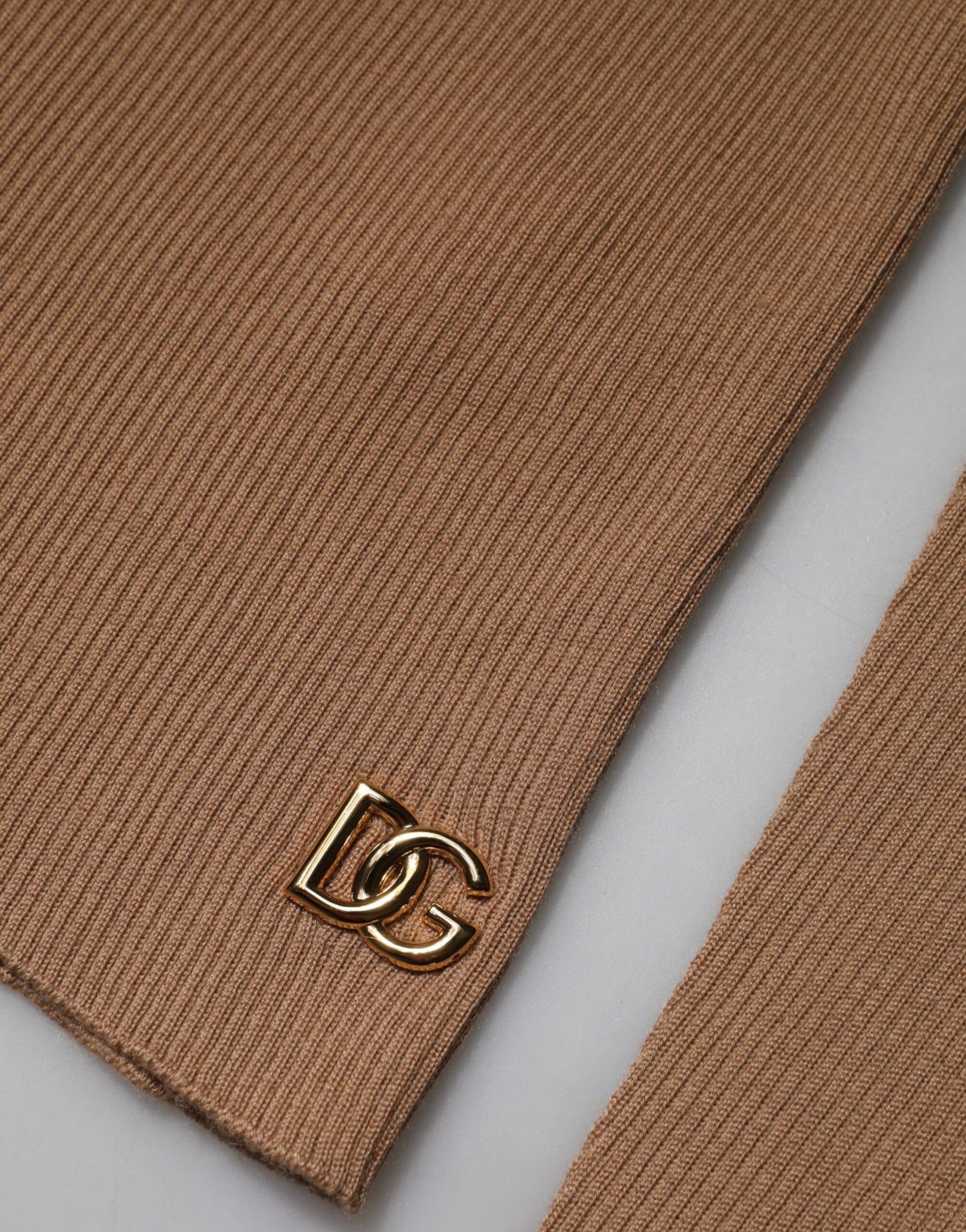 Brown tie with gold logo on end