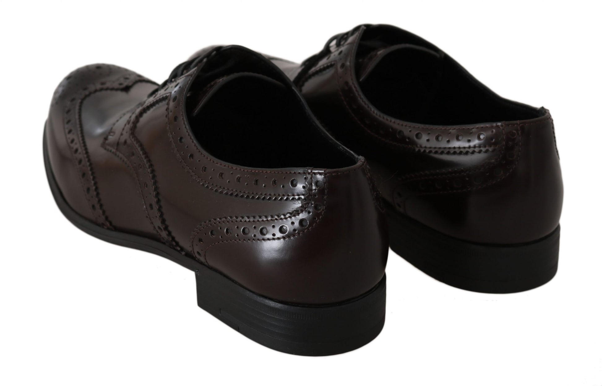 Pair of brown leather dress shoes with laces and a small heel