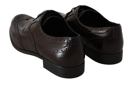 Pair of brown leather dress shoes with laces and a small heel
