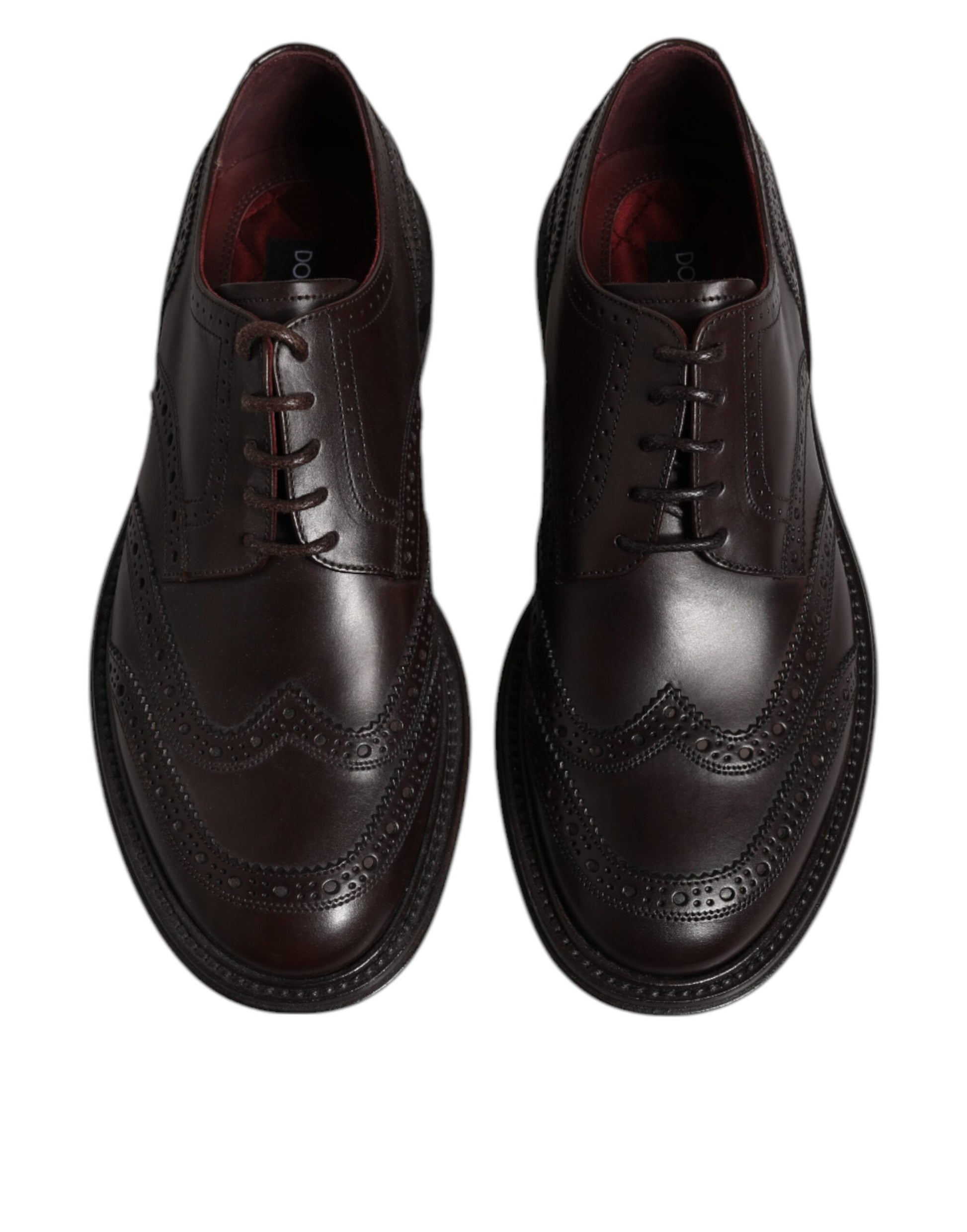 Pair of brown leather dress shoes with laces, wingtip design and perforated detailing