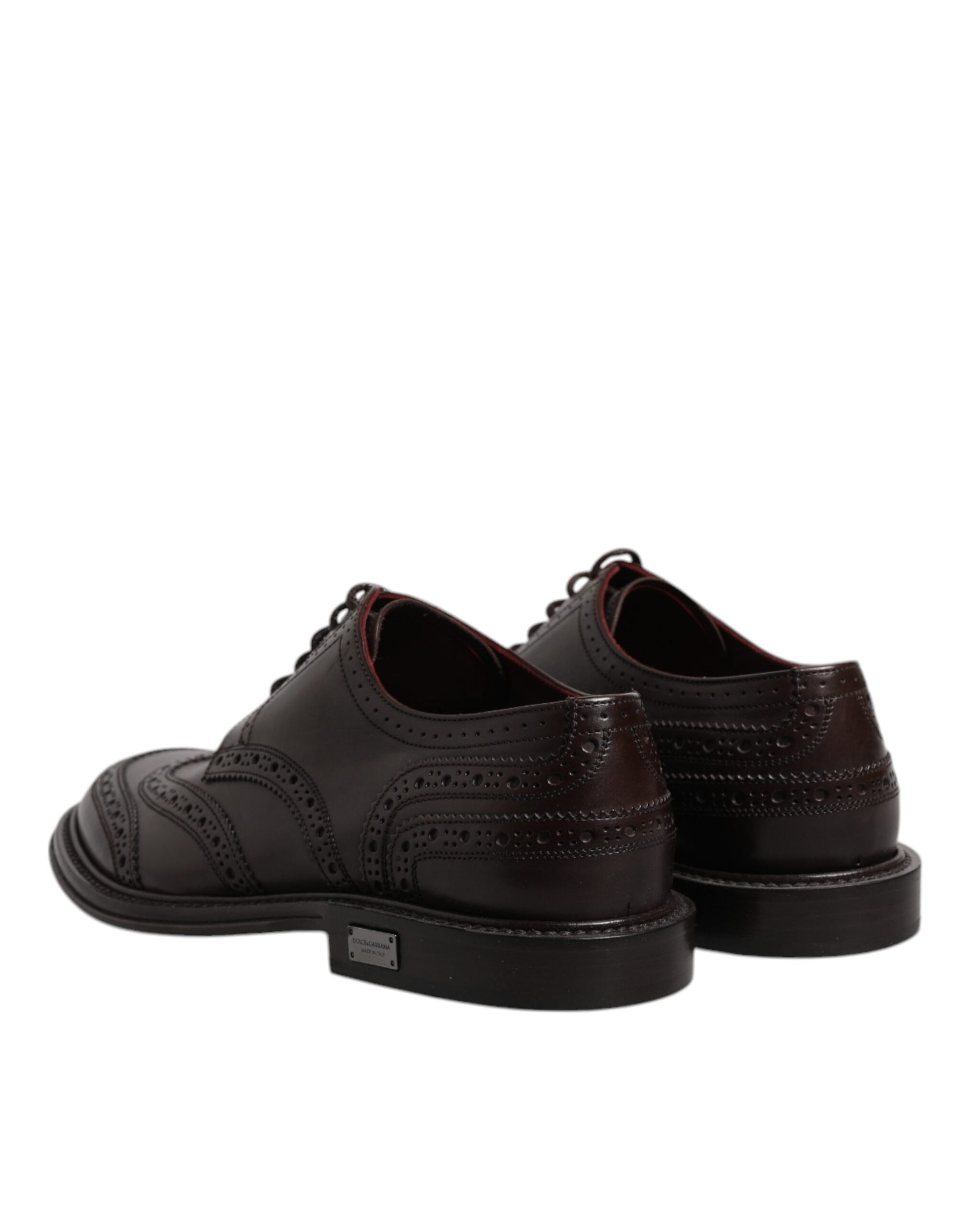 Pair of brown leather dress shoes with laces, wingtip design and a small logo on the side