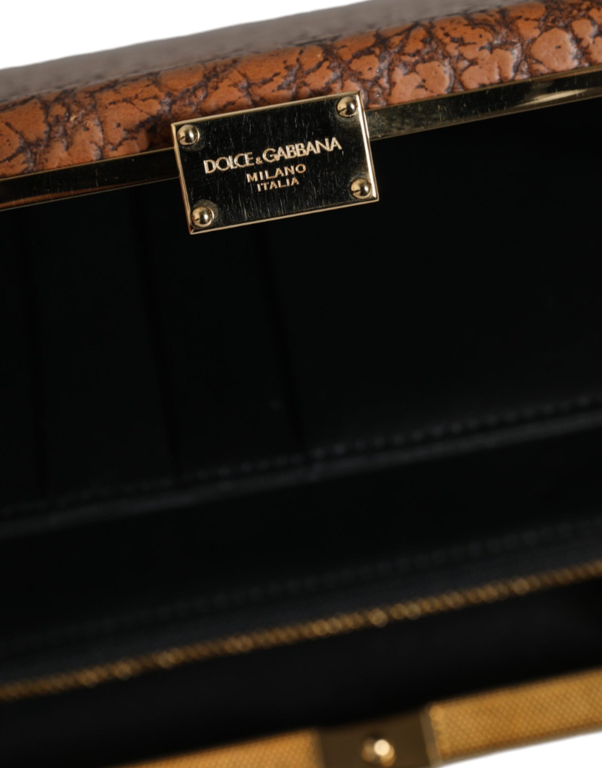 Brown leather handbag with gold hardware